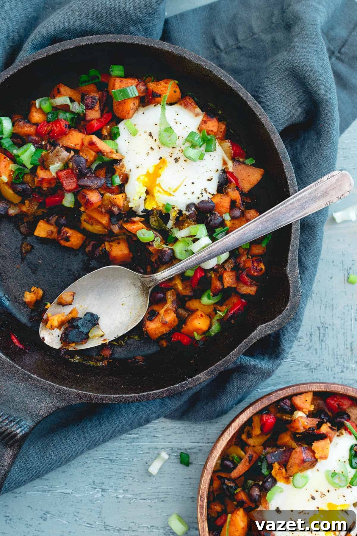 Harissa Sweet Potato Hash with Runny Eggs With a couple runny eggs on top, this harissa sweet potato hash is simple, spicy and perfect for a quick meal any time of day!