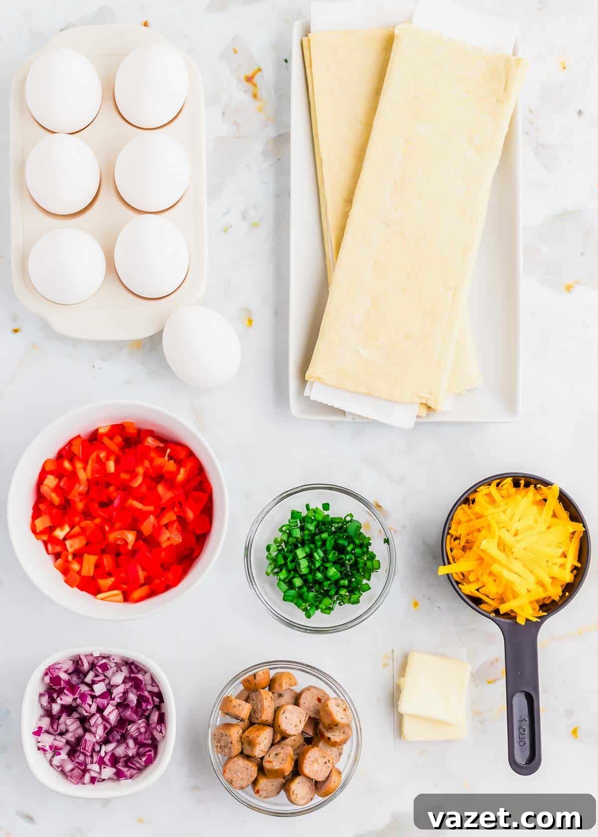 Artisan Stuffed Pockets 3 The ingredients for a breakfast hot pockets are laid out on a marble countertop.