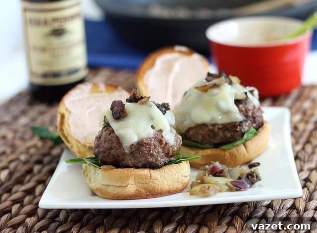 Beef sliders with mushrooms and swiss, garnished with fresh herbs