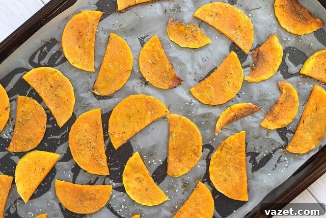Baked butternut squash chips on a baking sheet