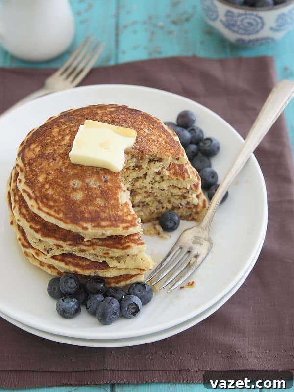 A beautiful stack of Meyer Lemon Quinoa Pancakes, ready to be eaten.