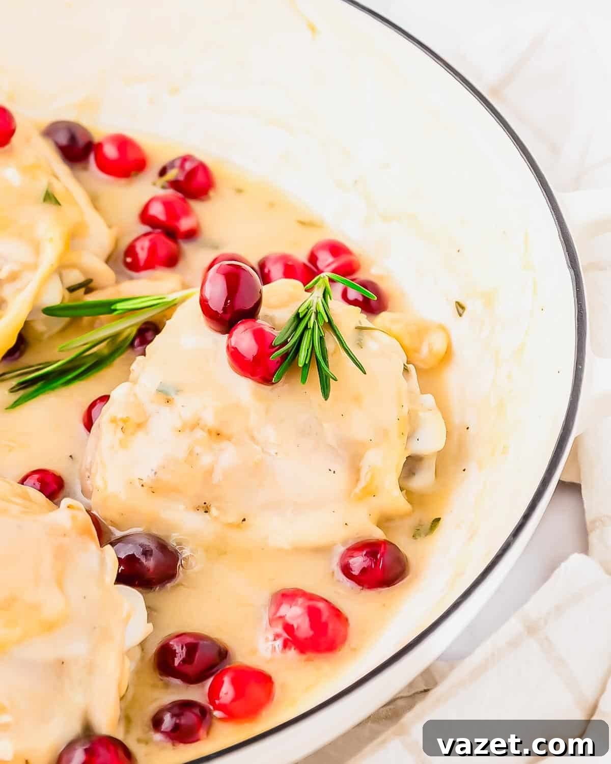 Cranberry Chicken Delight 4 Cranberry chicken breasts served in a white dish.