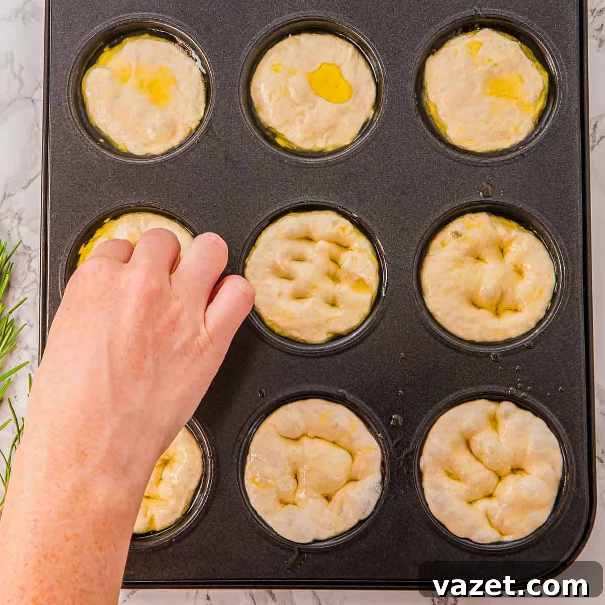 Making dimples in the dough.