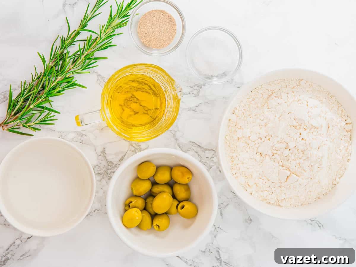 Ingredients for focaccia muffins: flour, olives, olive oil, yeast, water, and rosemary.