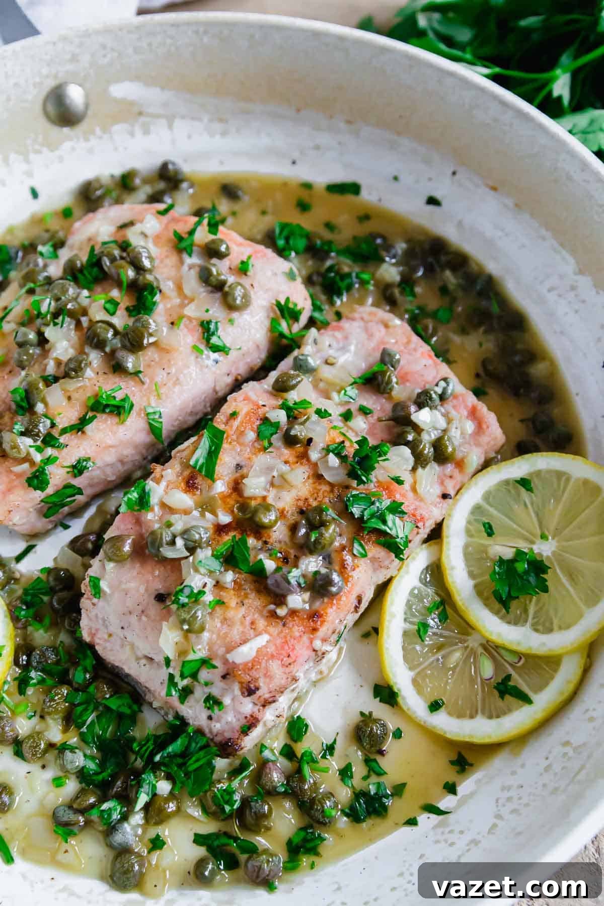 Lemon Butter Salmon Piccata with Capers and Parsley 2 Salmon piccata recipe in a pan.