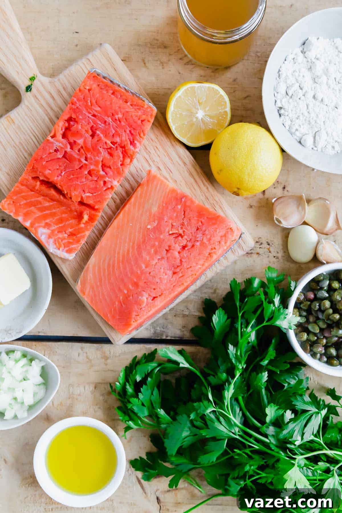 Lemon Butter Salmon Piccata with Capers and Parsley 3 Ingredients to make salmon piccata on wooden surface.