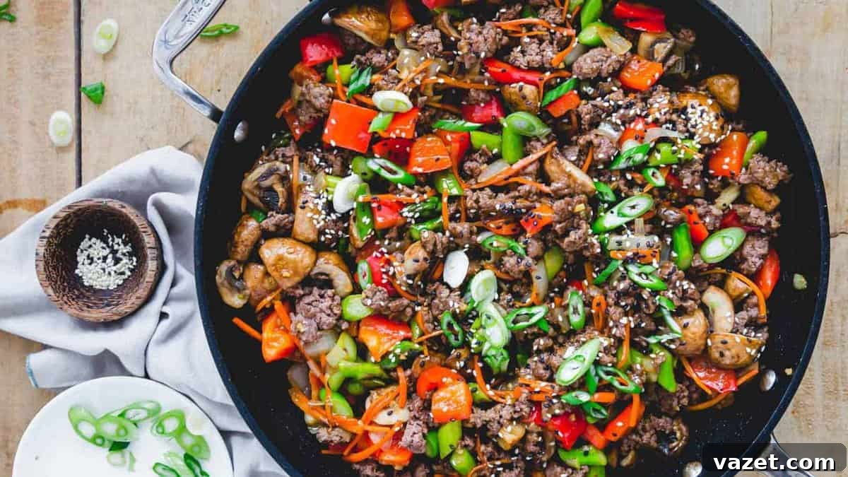 Create Flavorful Meals Without Sugar, Cream, or Cheese 4 A skillet full of vegetables and beef on a wooden table.